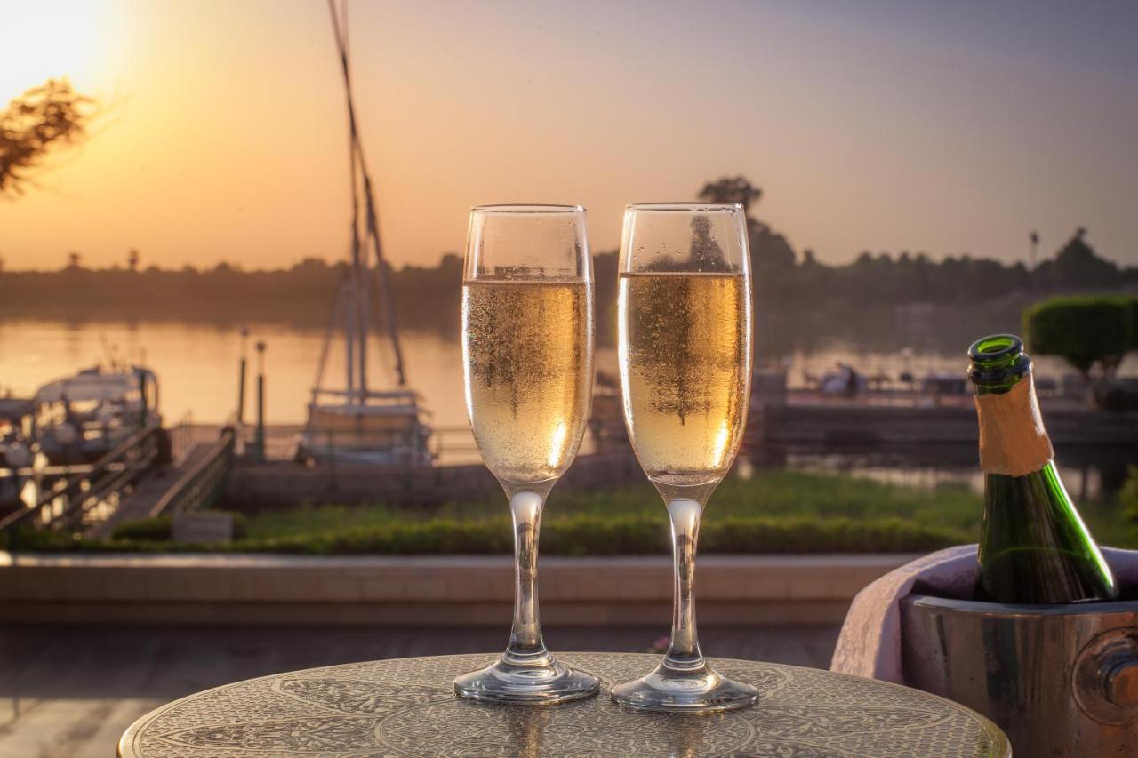 Jolie Ville Hotel & Spa Kings Island Luxor Eksteriør billede Two champagne flutes